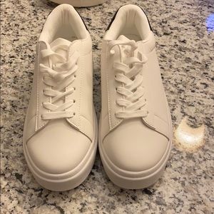 white platform sneakers with black detailing
